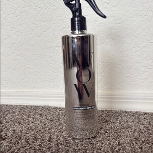 Silver and Black Hair Styling Spray Bottle with Sleek Design